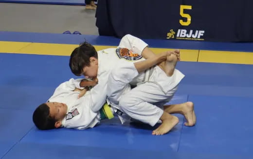 a couple of men in karate uniforms