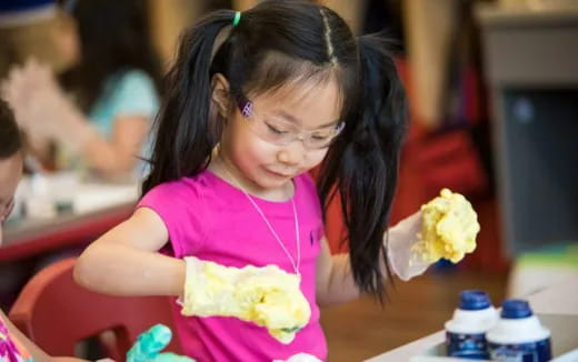 a girl eating a cake