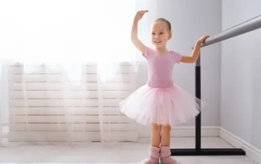 a girl in a pink dress