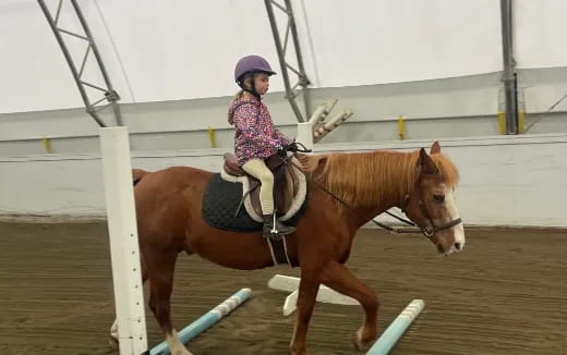 a girl riding a horse