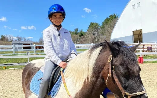 a girl riding a horse