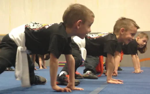 a group of boys in black uniforms