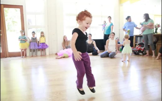 a group of children dancing