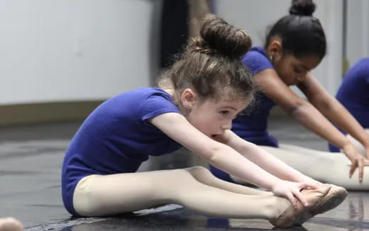 a group of children doing yoga