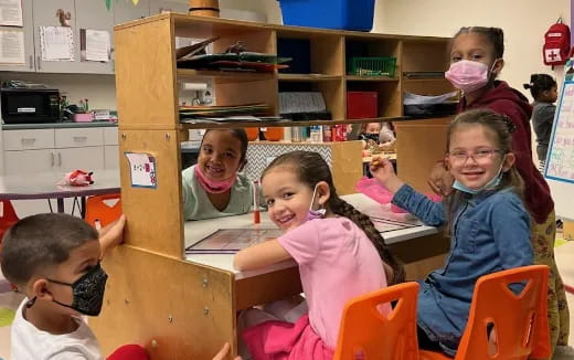 a group of children in a classroom