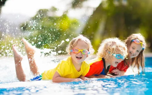 a group of children in a pool