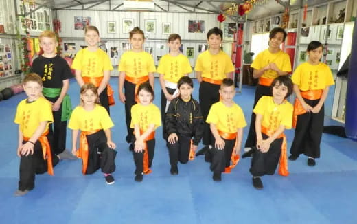 a group of children in yellow t-shirts