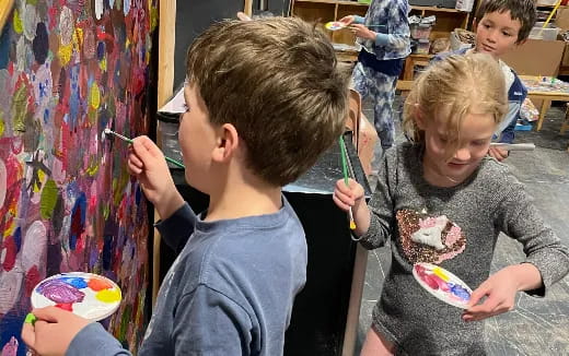 a group of children painting