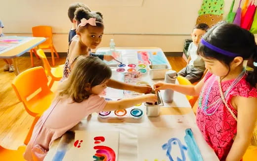 a group of children painting