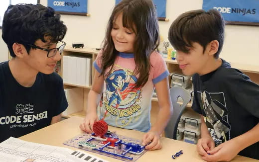 a group of children playing with a toy