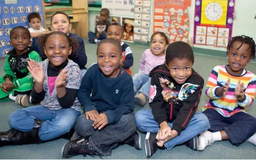 a group of children sitting on the floor