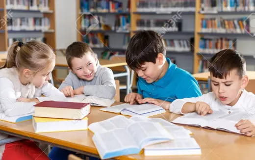 a group of children studying