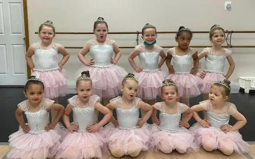 a group of girls in dresses