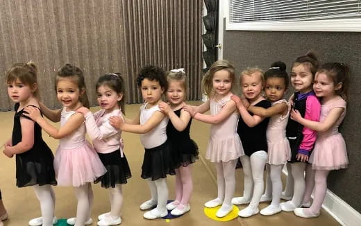 a group of girls posing for a photo