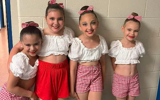 a group of girls posing for a photo
