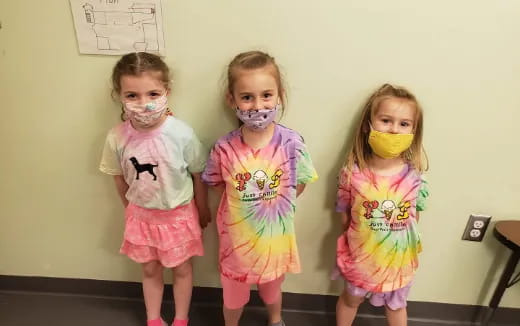 a group of girls wearing clothing