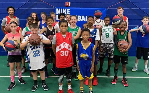 a group of kids holding basketballs