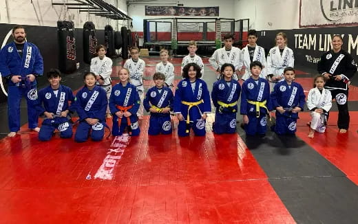 a group of kids posing for a photo