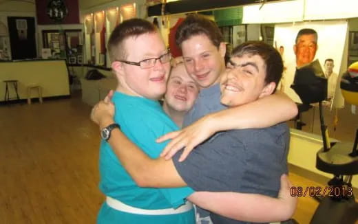 a group of men hugging