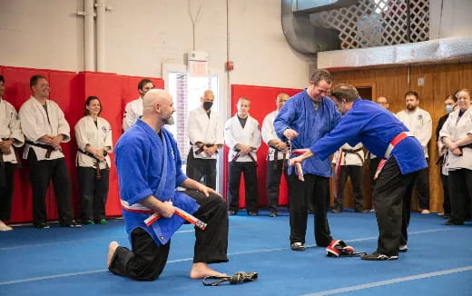 a group of men in a wrestling ring