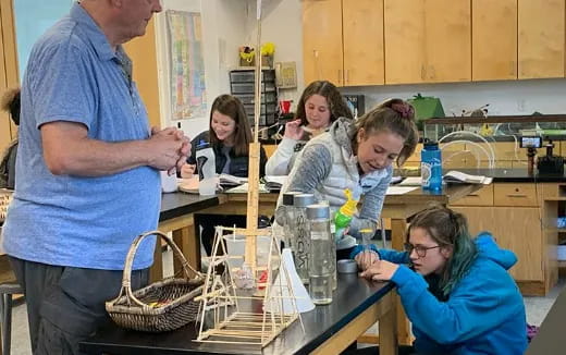 a group of people in a kitchen