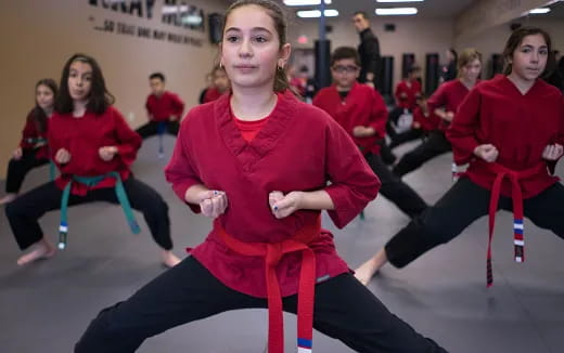 a group of people in red uniforms