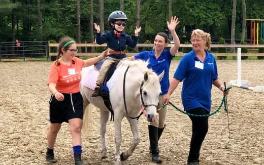 a group of people on a horse