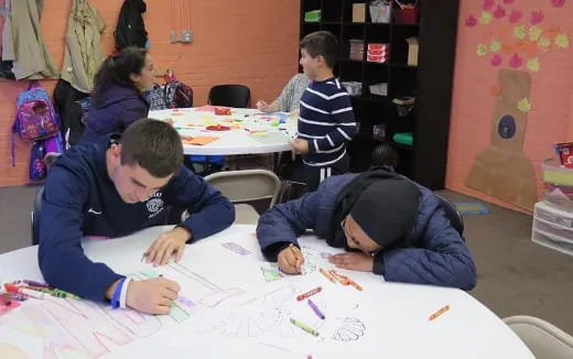 a group of people sitting at a table