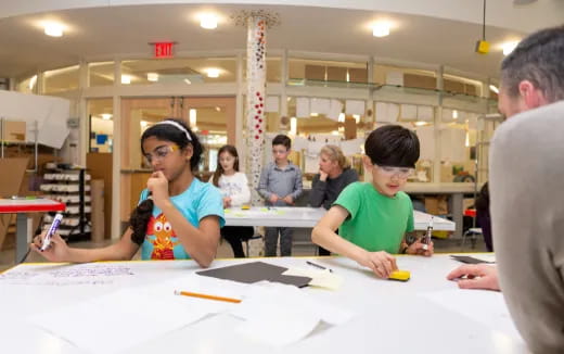 a group of people sitting at tables