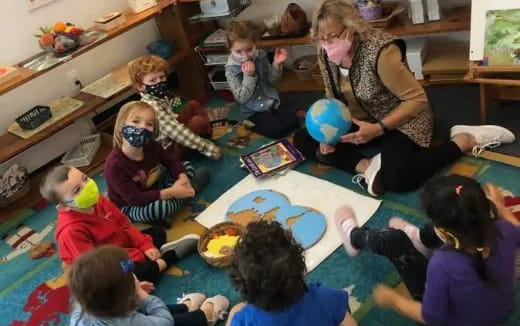 a group of people sitting on the floor