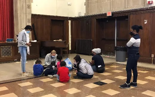 a group of people sitting on the ground
