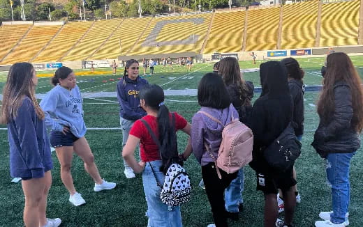 a group of people standing on a field