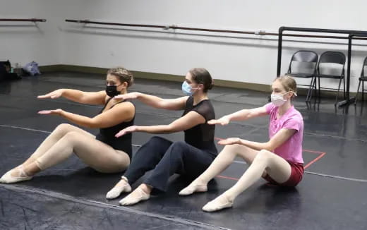 a group of people wearing masks