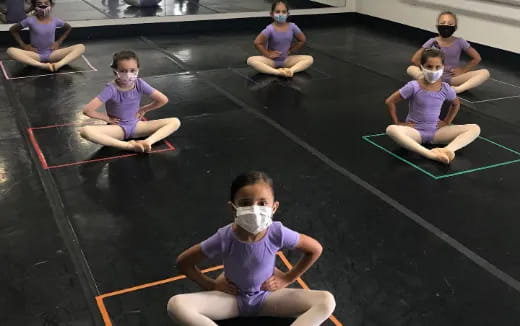 a group of people wearing masks