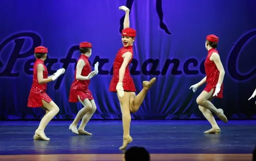 a group of women dancing on a stage