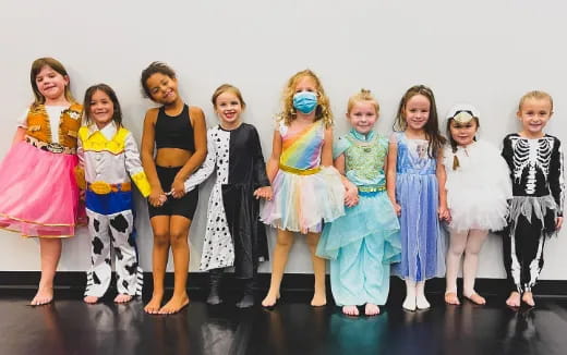 a group of women in dresses