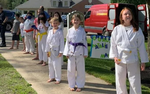 a group of women in white uniforms