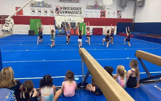 a group of women playing volleyball