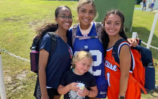 a group of women posing for a photo