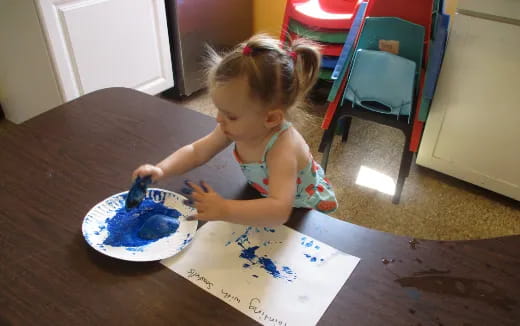 a little girl eating cake