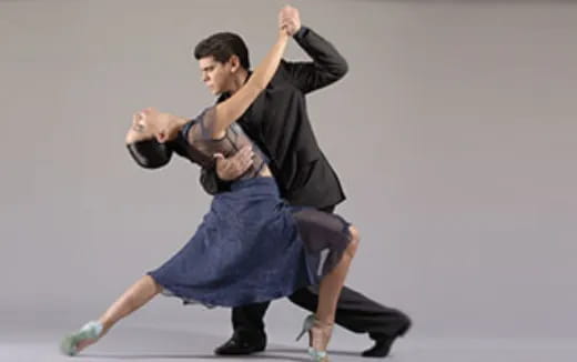 a man and woman dancing