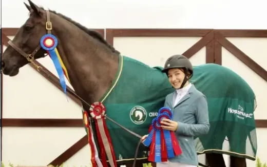 a man holding a horse