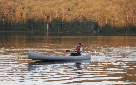 a man in a boat on the water