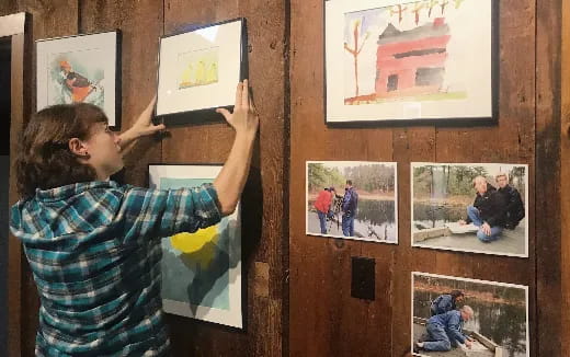 a man painting pictures