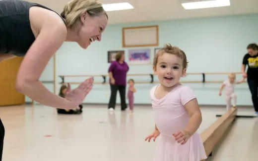 a person and a child dancing