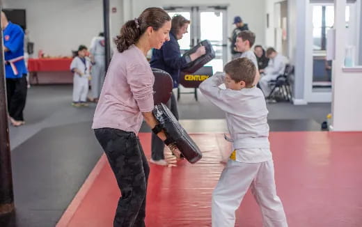 a person and a child in a gym