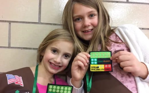 a person and a girl holding a box