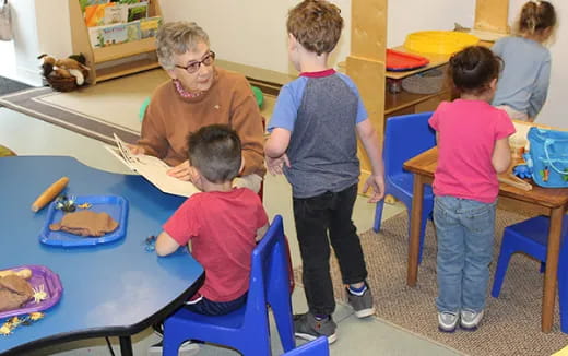 a person and a group of children