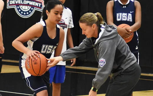 a person holding a basketball