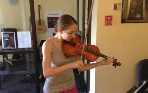 a person playing a violin